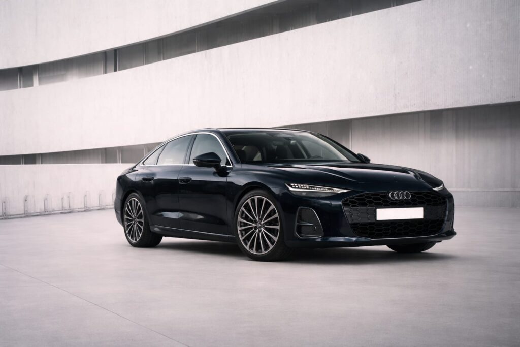Audi A6 Black luxury sedan parked in a modern minimal background